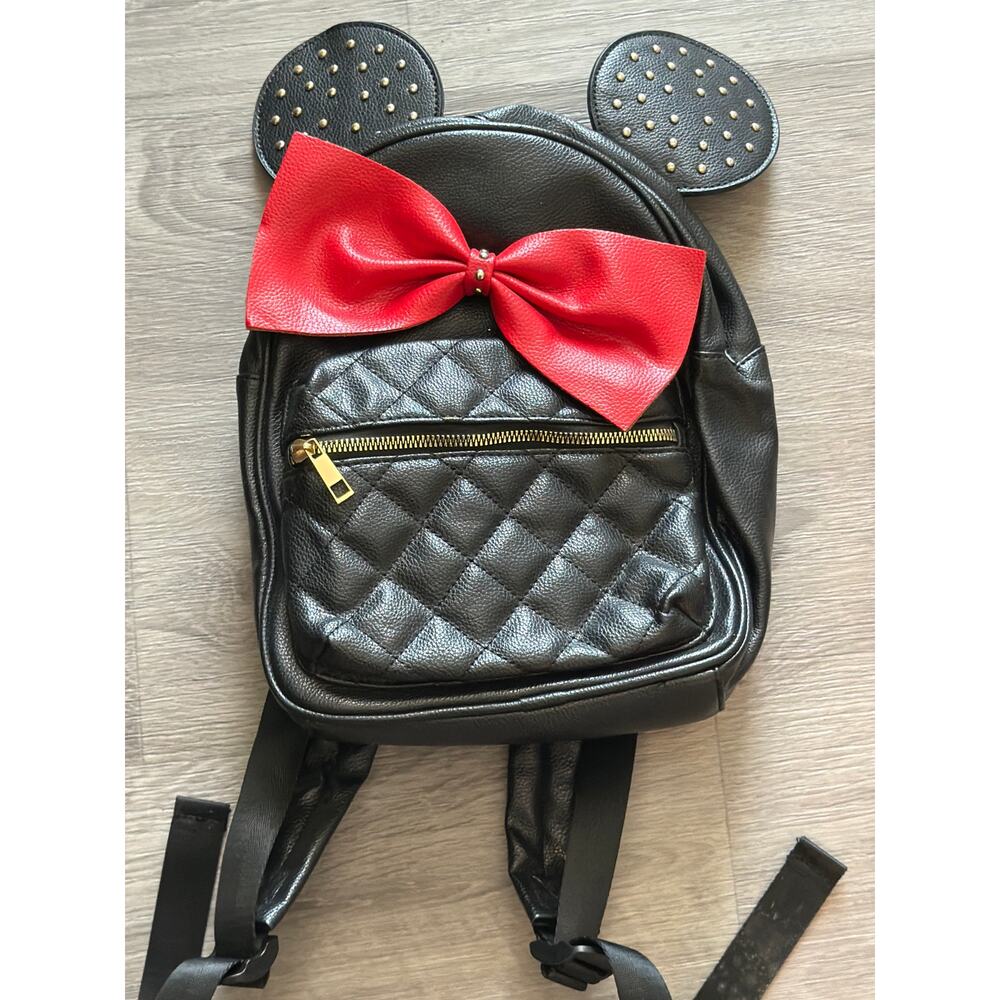 Olivia Miller Minnie Mouse ear black backpack with a red bow
